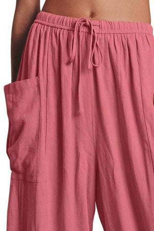 a woman wearing pink shorts with a pocket