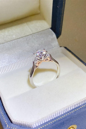 a diamond ring in a blue box on a table