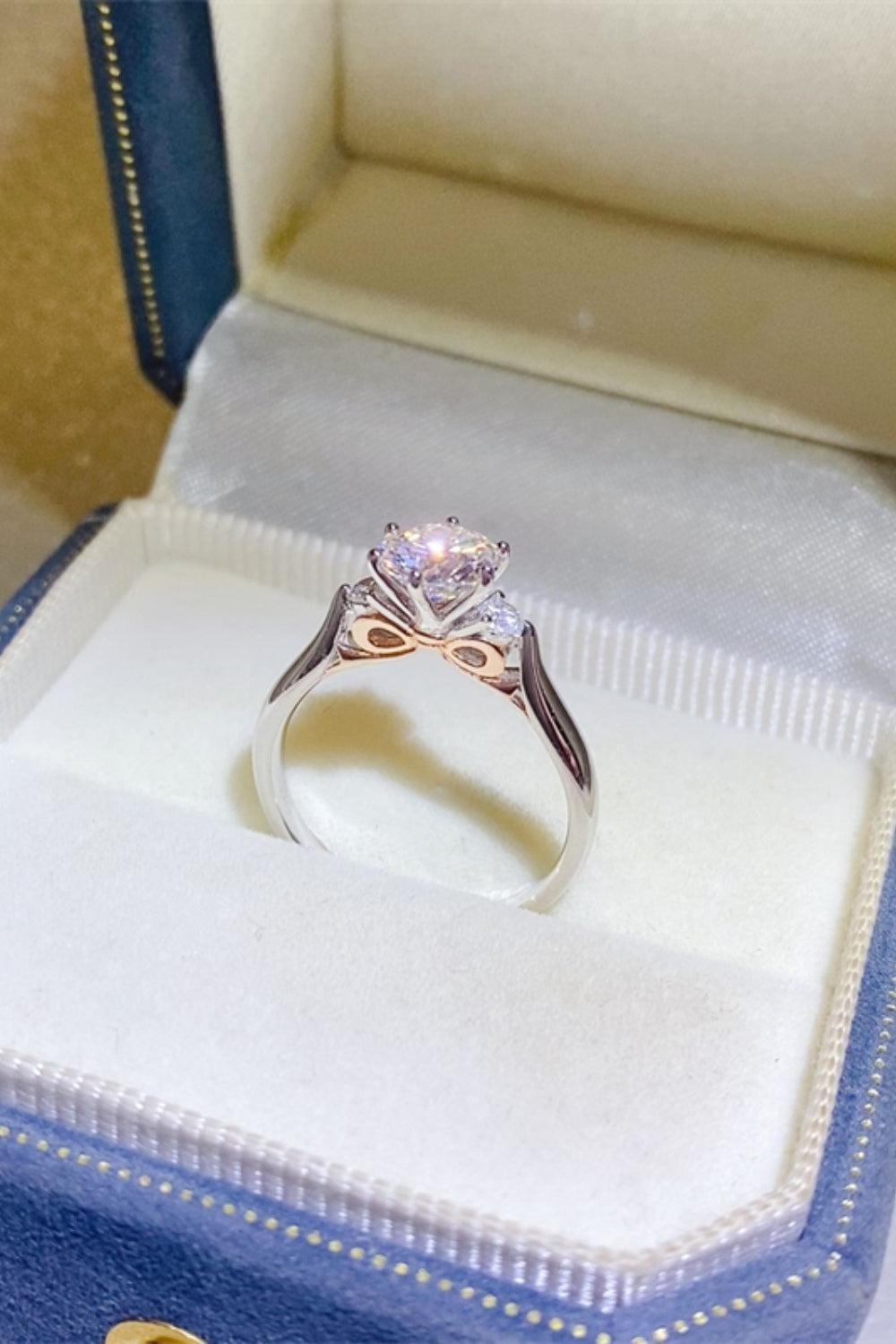 a diamond ring in a blue box on a table