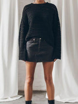 a woman standing in front of a white curtain