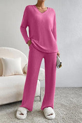 a woman in a pink sweater and matching pants