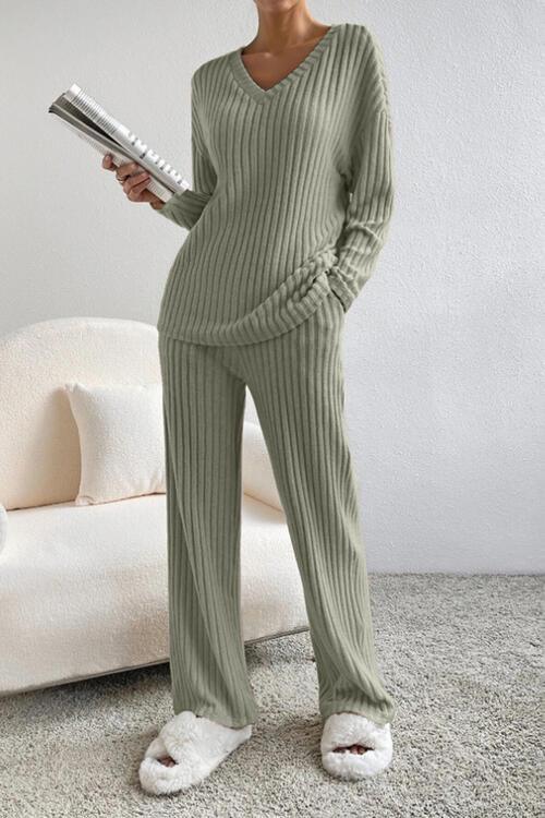 a woman in a green sweater and pants