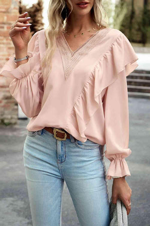 a woman in a pink top smoking a cigarette