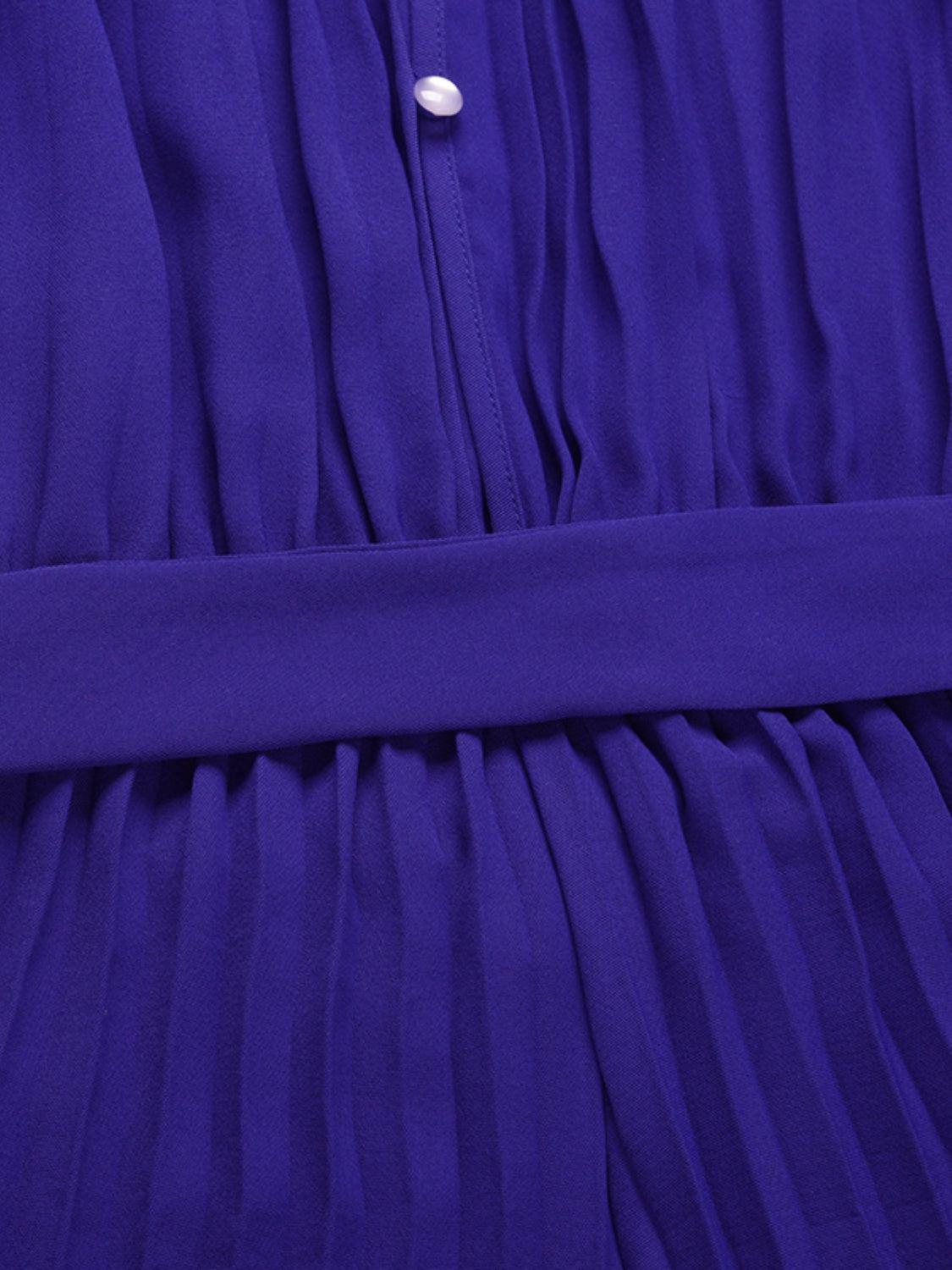 a close up of a purple dress with buttons