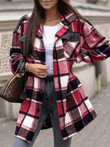 a woman wearing a red and black plaid coat