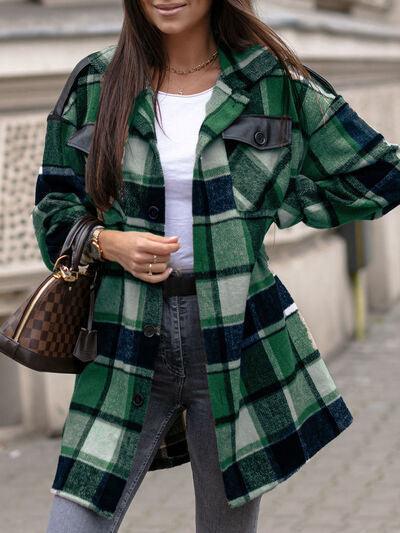 a woman wearing a green and black plaid coat