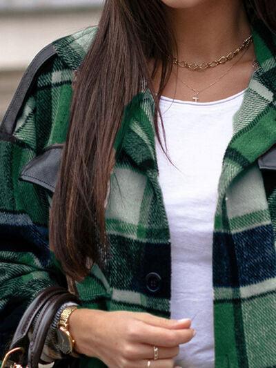 a woman wearing a green and black checkered coat