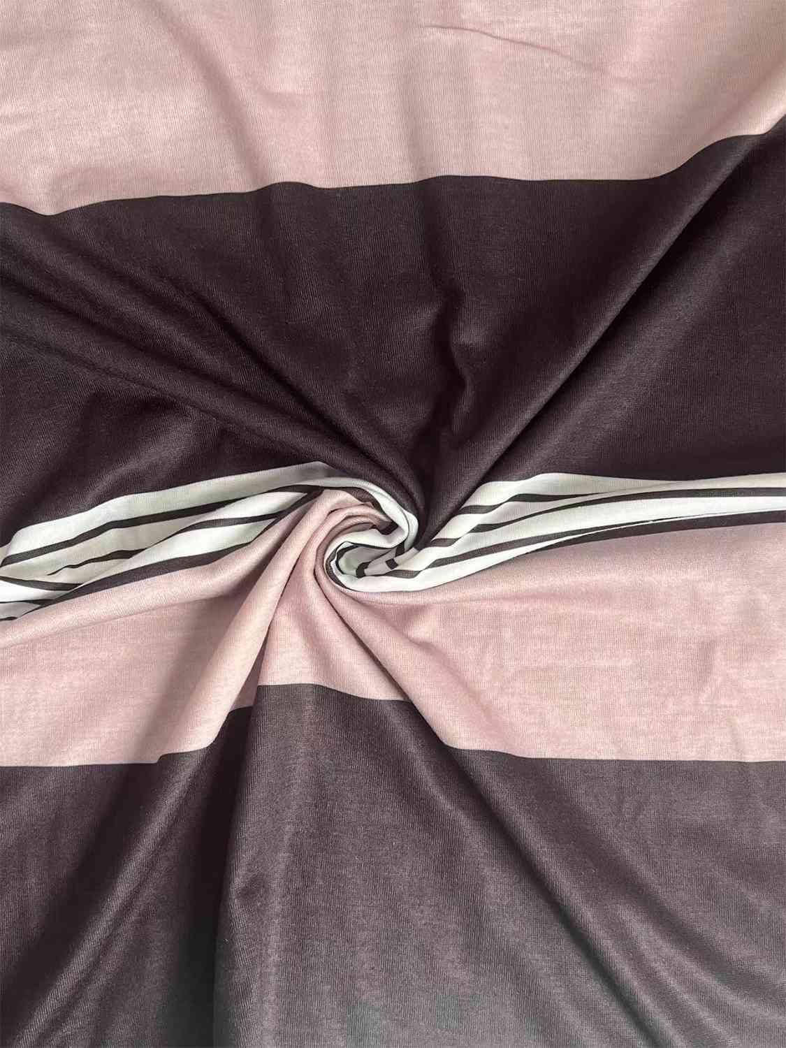 a close up of a pink and black blanket