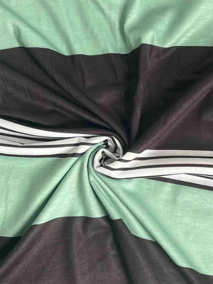 a close up of a green and black striped fabric