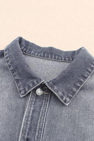a close up of a denim shirt with buttons