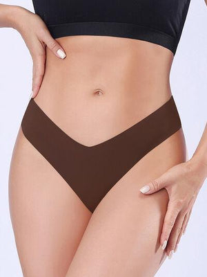 a woman in a black bikini top and brown panties