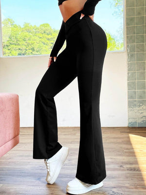 a woman in a black top and black pants