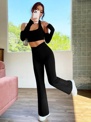 a woman in a black top and black pants