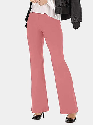 a woman in a black jacket and pink pants