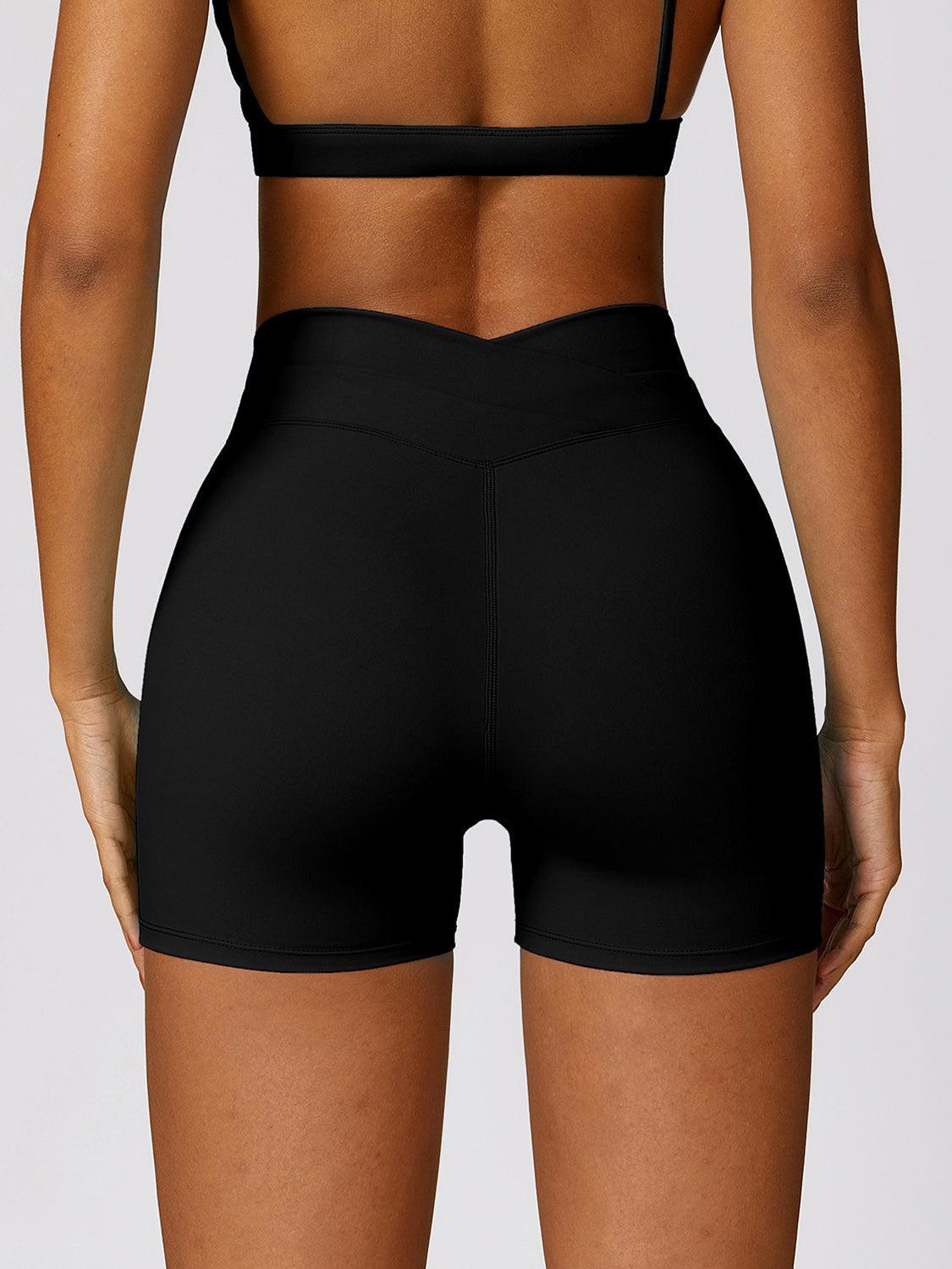 the back of a woman in black shorts