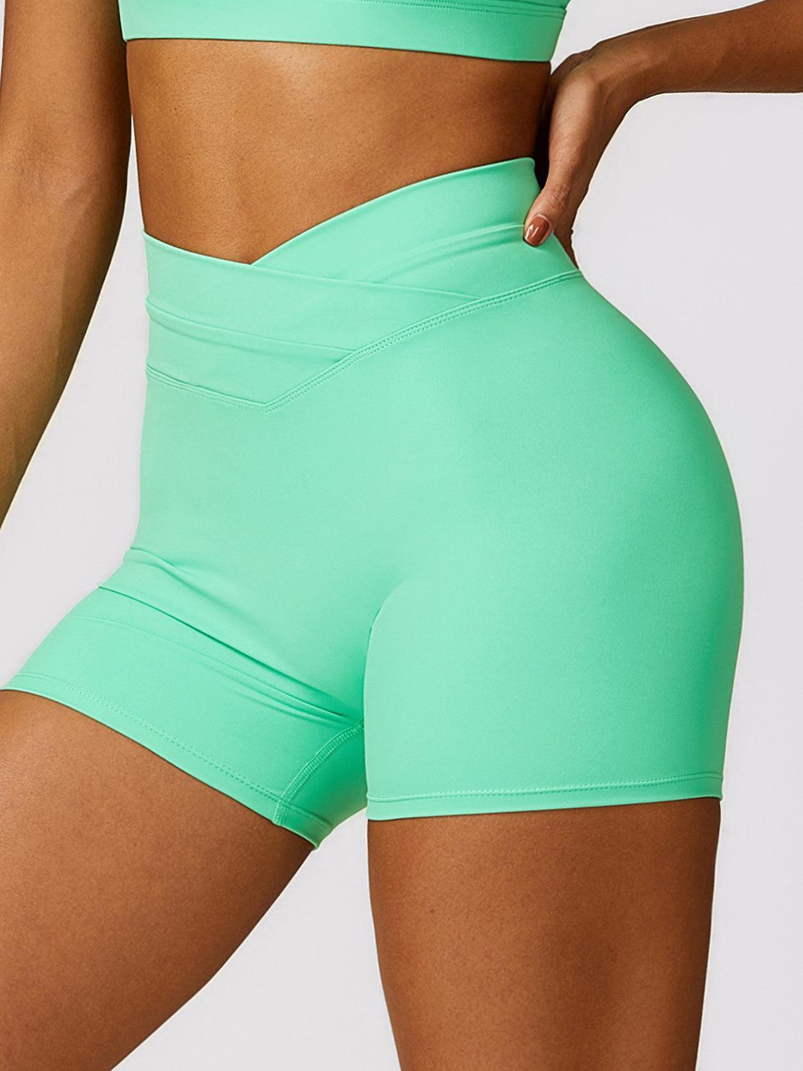 a close up of a person wearing a green shorts