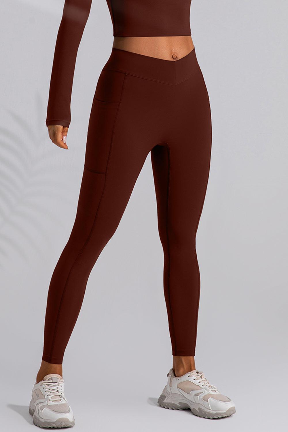 a woman in a brown top and leggings