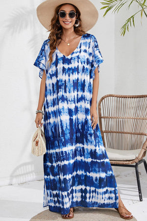 a woman wearing a blue and white tie dye dress