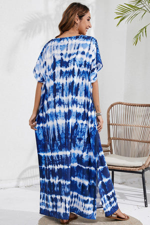 a woman wearing a blue and white tie dye dress