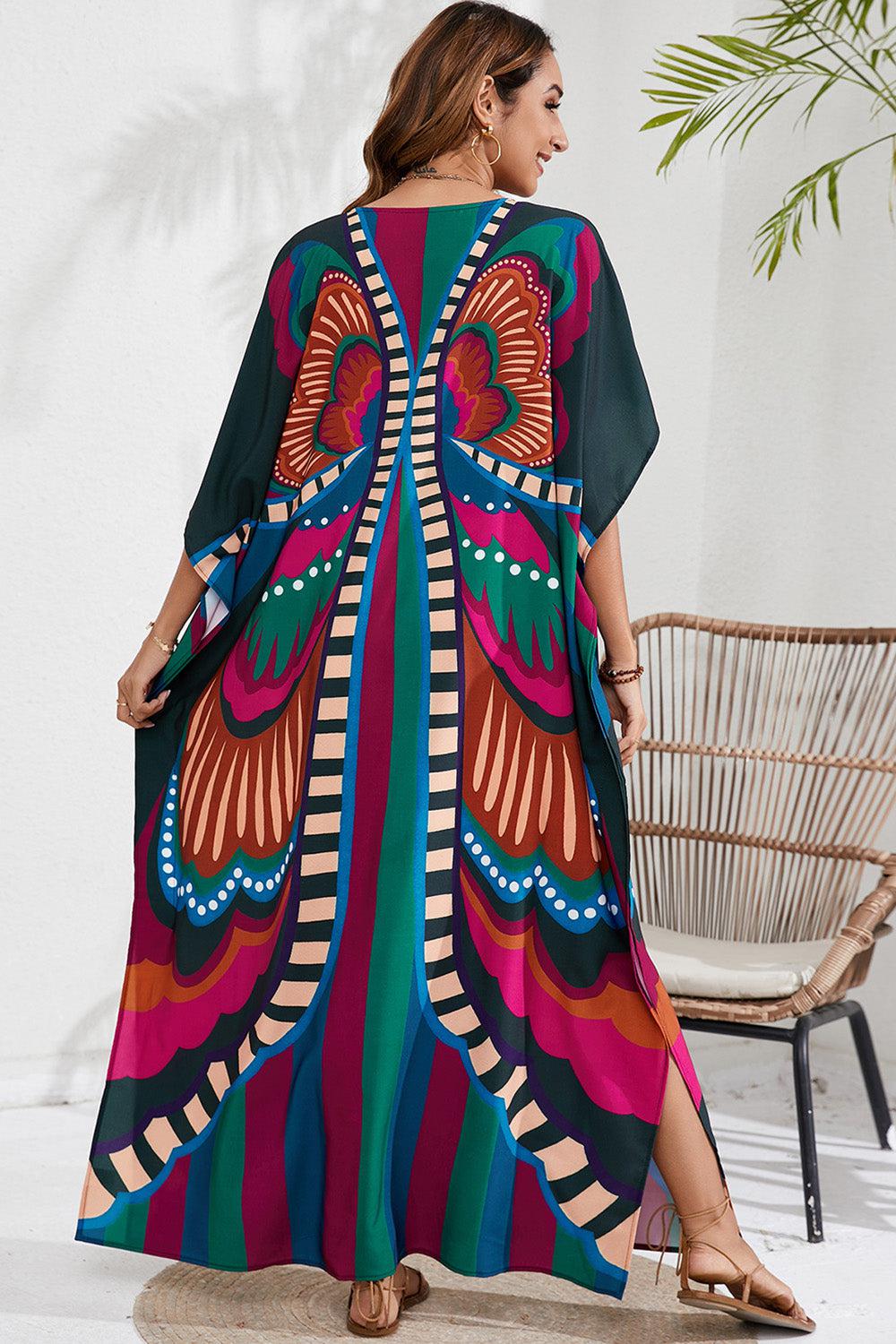 a woman in a colorful dress standing in front of a chair