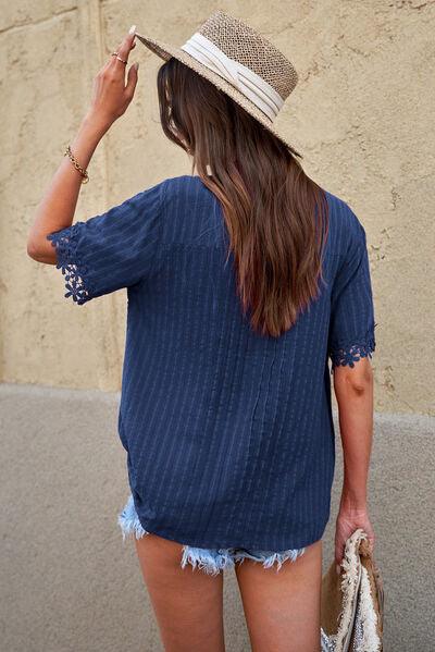 a woman wearing a hat and a blue shirt