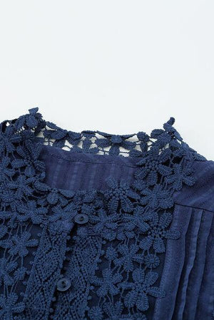 a close up of a shirt with a lace on it