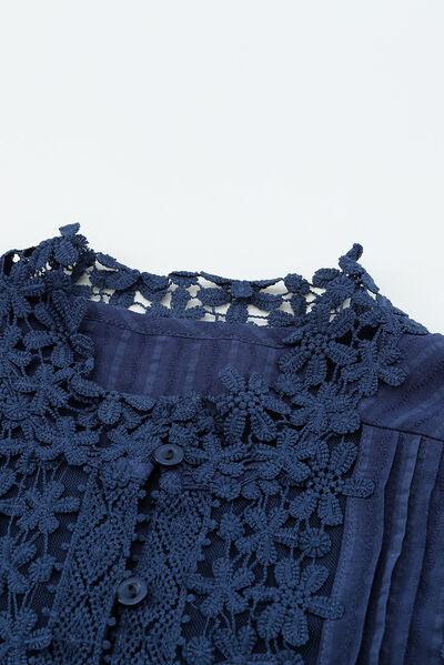 a close up of a shirt with a lace on it