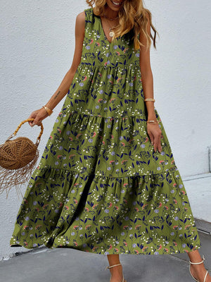 a woman wearing a green floral print dress