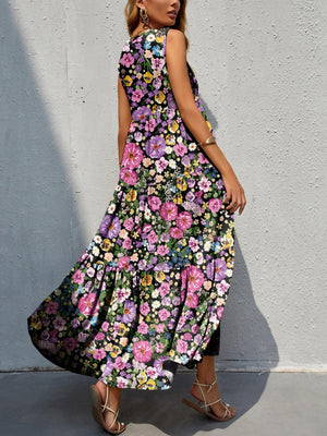 a woman in a long dress standing against a wall