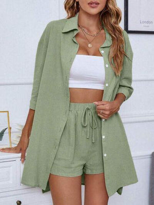 a woman wearing a green jacket and shorts