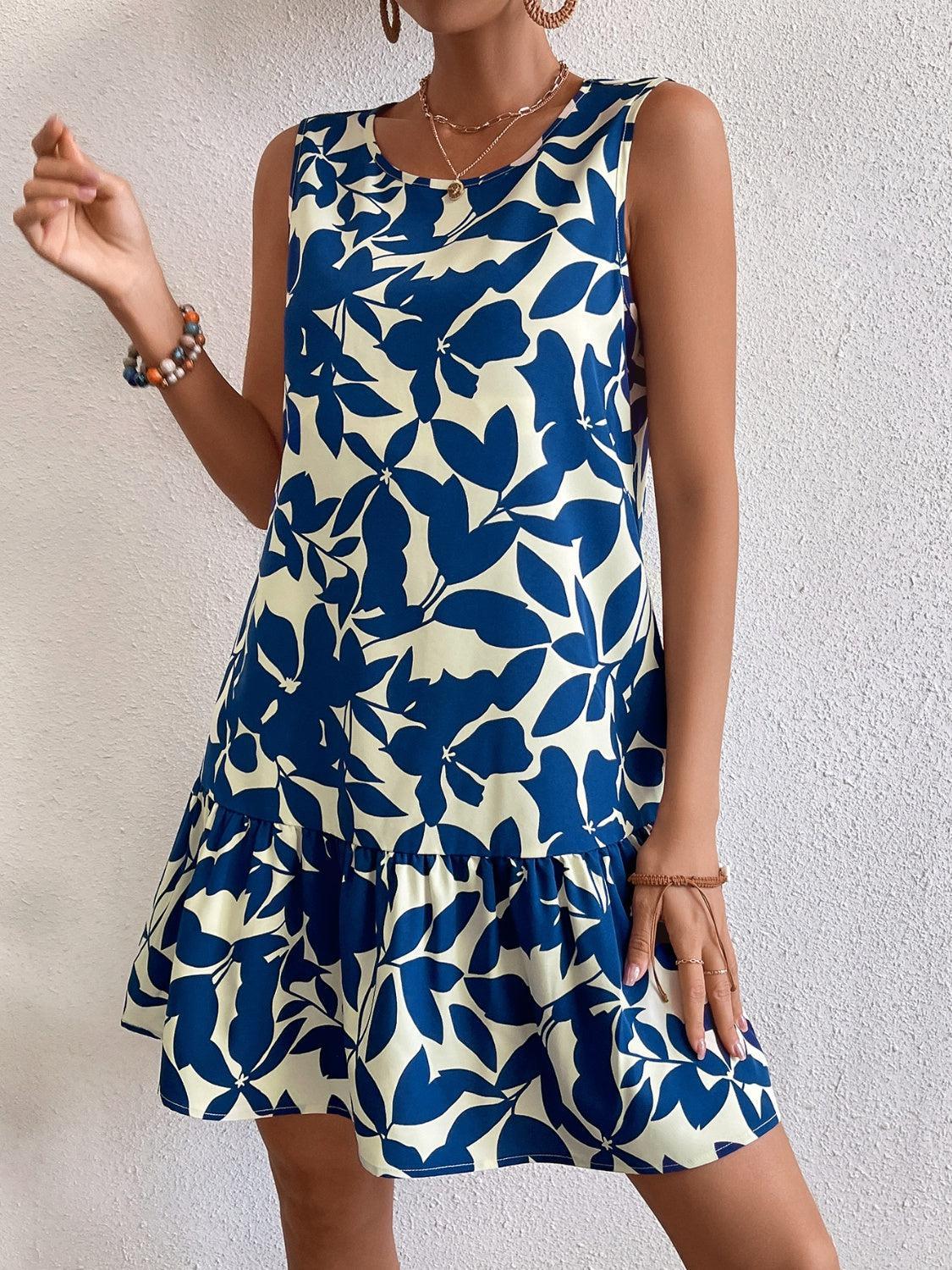 a woman in a blue and white dress posing for a picture