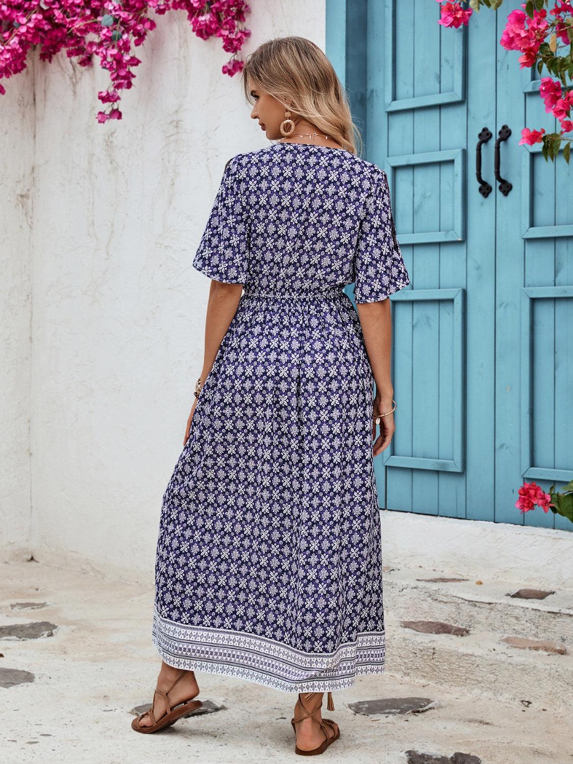 a woman standing in front of a blue door