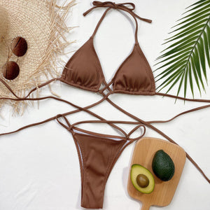 a bikini top with an avocado and a straw hat