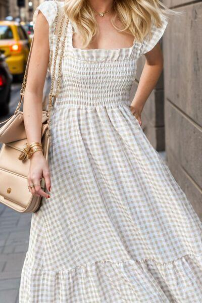 a woman in a dress is walking down the street