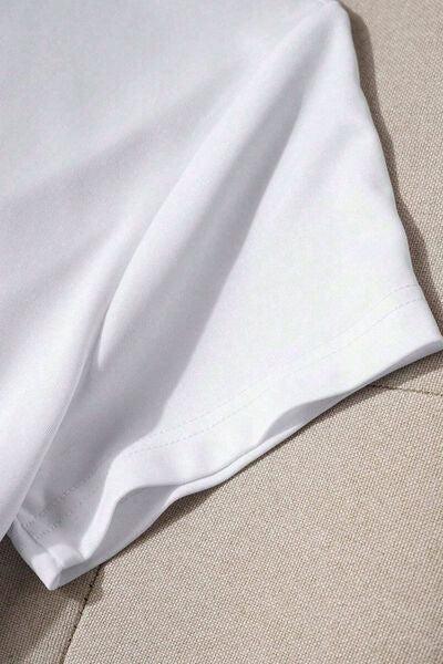 a close up of a white shirt on a couch