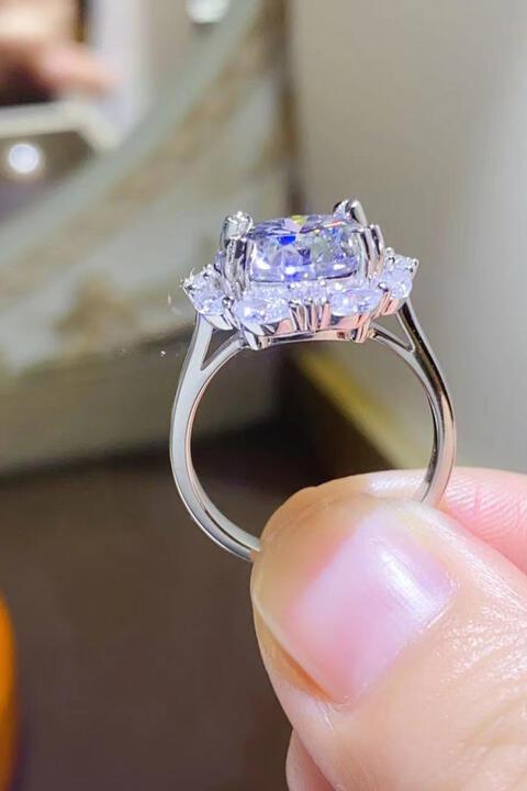 a close up of a person holding a ring