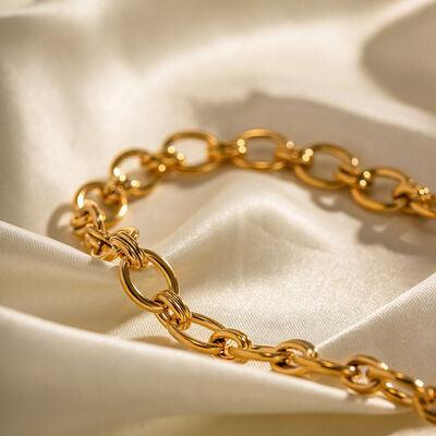 a close up of a gold chain bracelet