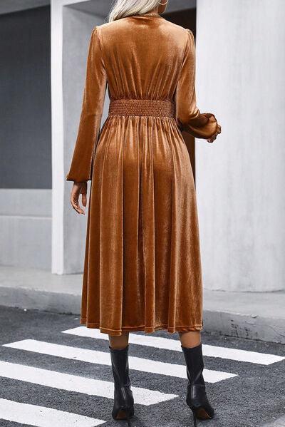 a woman in a brown dress is crossing the street