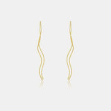 a pair of yellow gold earrings on a white background