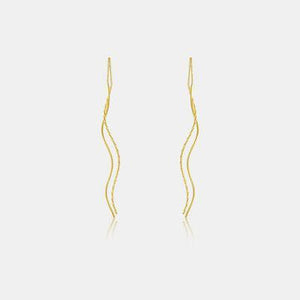 a pair of yellow gold earrings on a white background