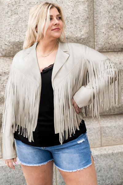 a woman in a short denim shorts and a leather jacket