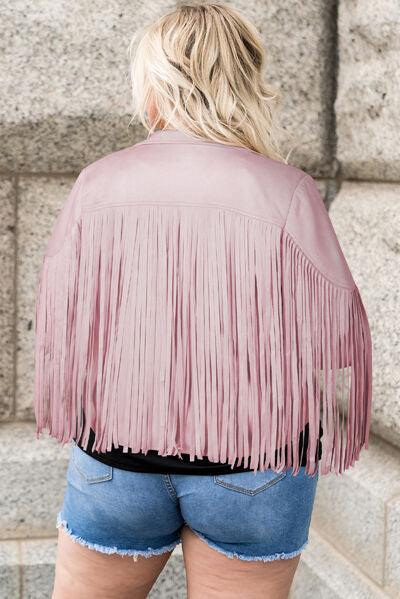 a woman wearing a pink leather jacket and denim shorts