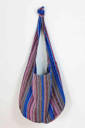 a multicolored bag hanging on a wall