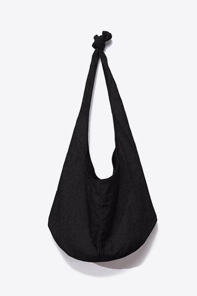 a black bag hanging on a wall