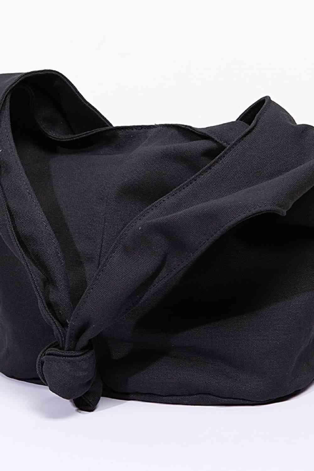 a black bag with a knot on the side