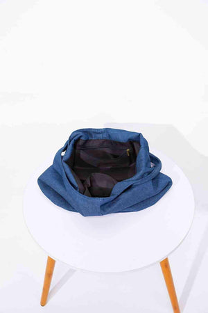 a blue bag sitting on top of a white table