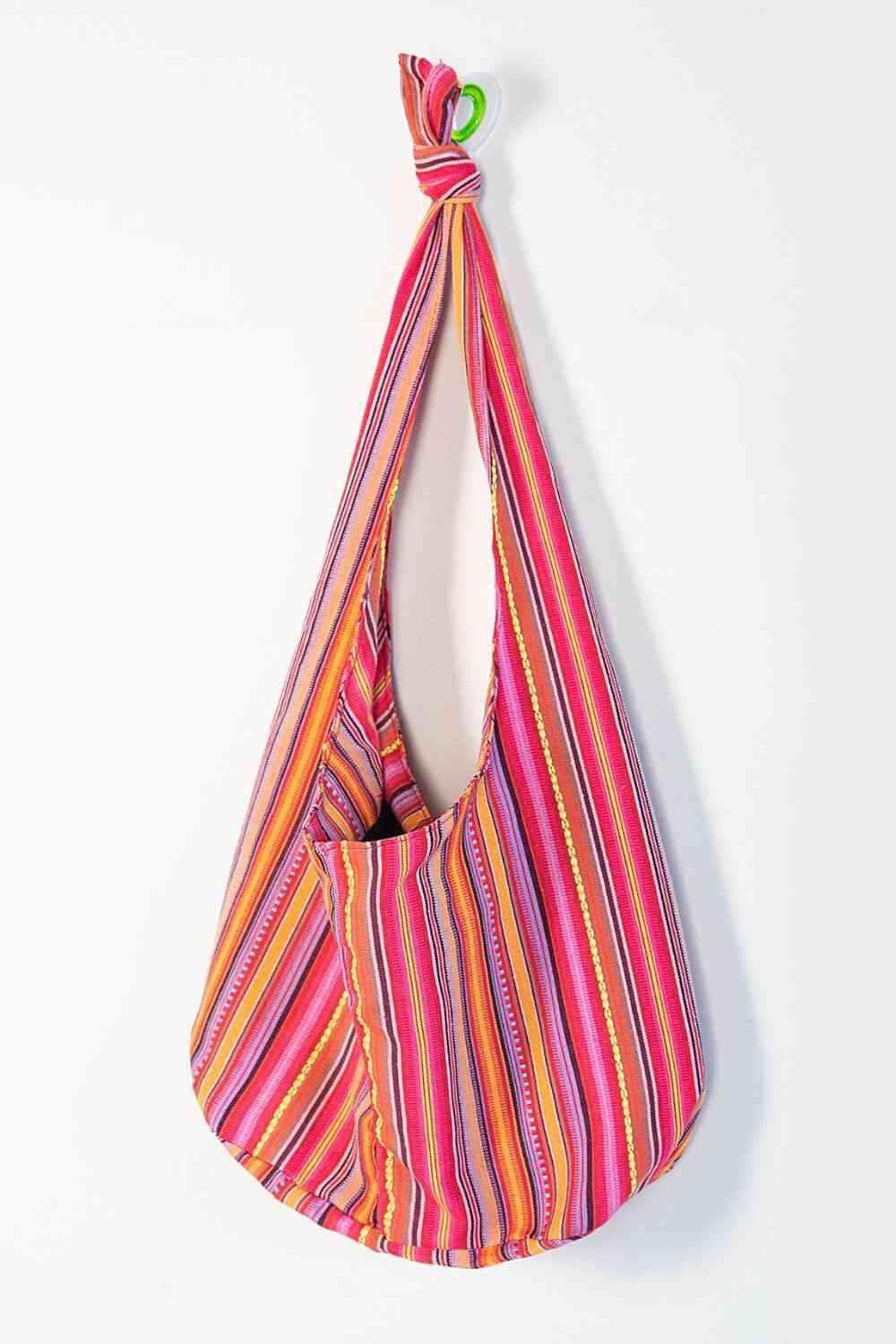 a multicolored bag hanging on a wall