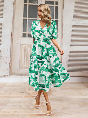 a woman in a green and white dress