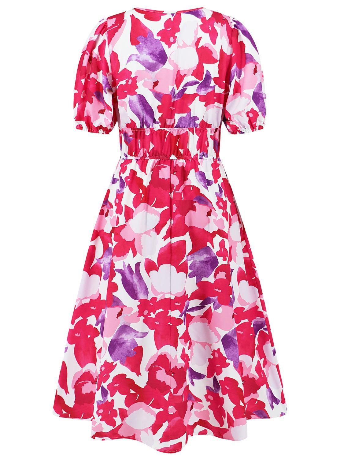 a dress with pink and purple flowers on it