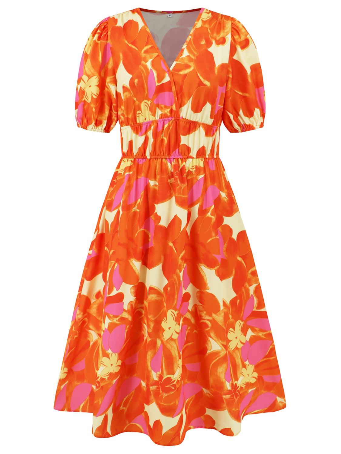 an orange and pink dress with flowers on it